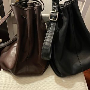 Two vintage Coach purses. One black and one chocolate. Excellent shape.